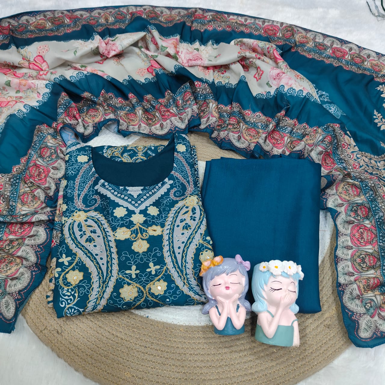 Ivory Pakistani Suit which is beautifully decorated with digital prints