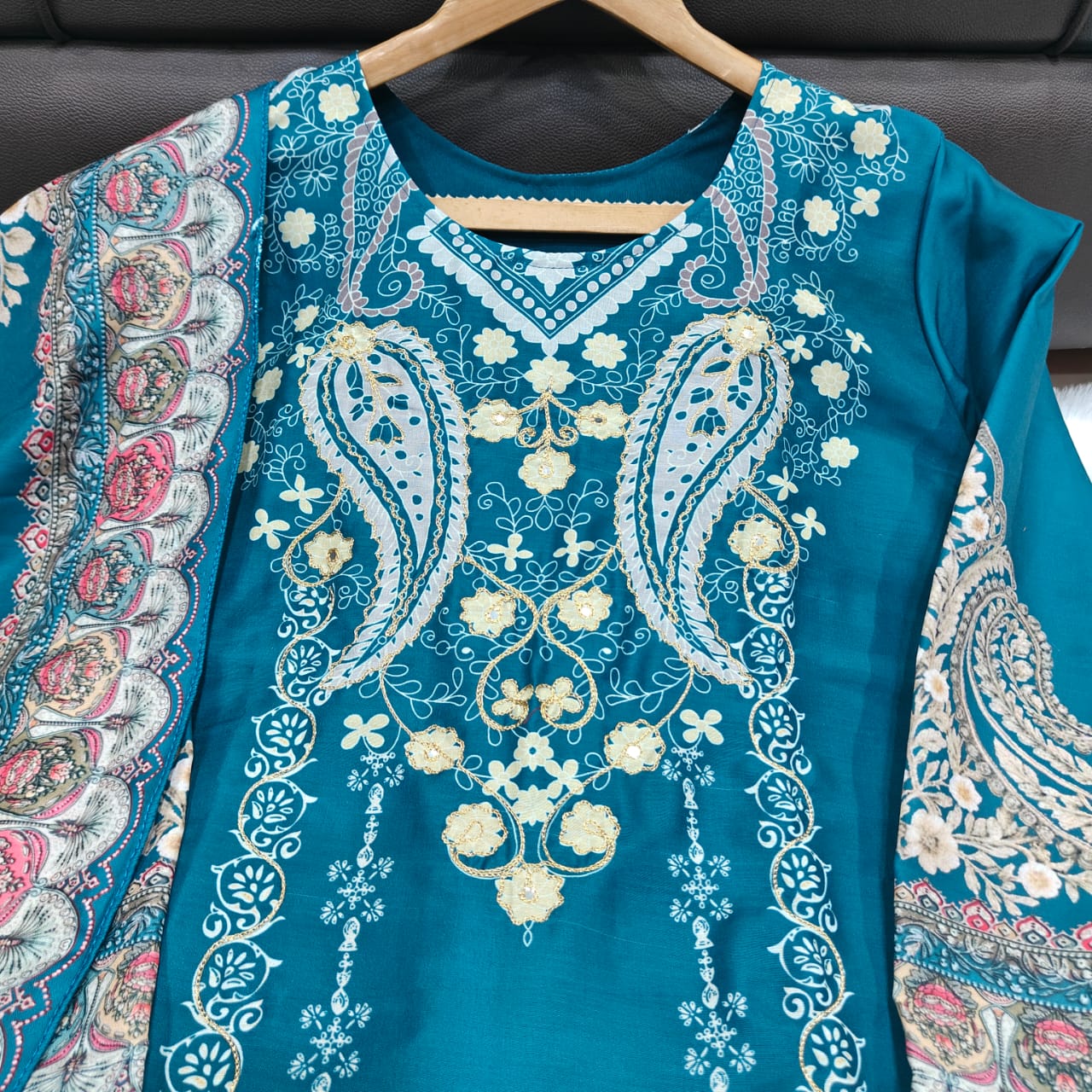 Ivory Pakistani Suit which is beautifully decorated with digital prints