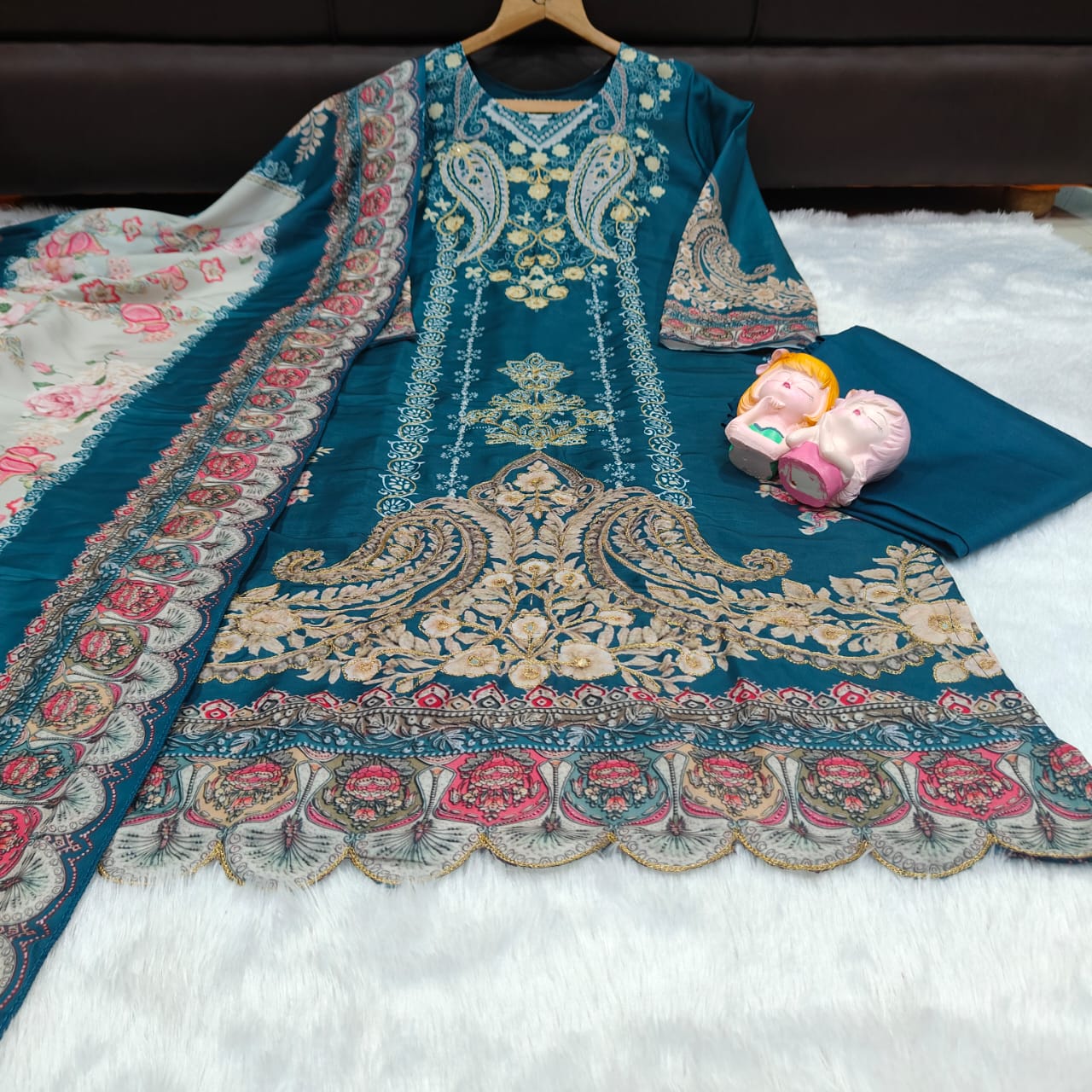Ivory Pakistani Suit which is beautifully decorated with digital prints